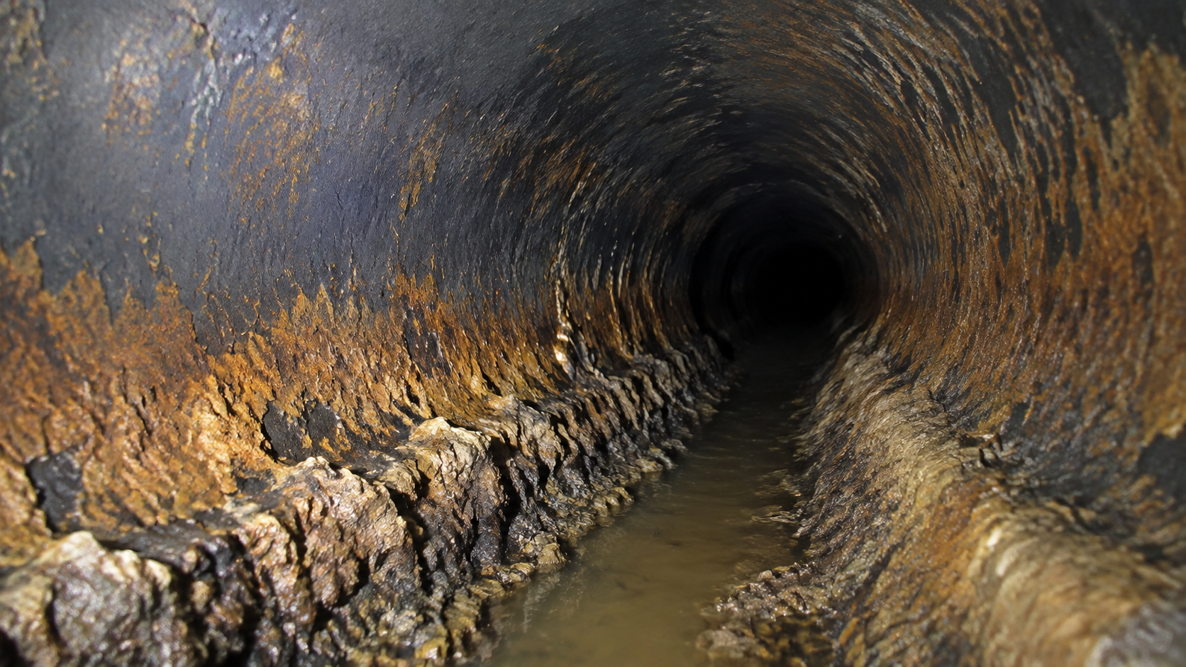 Corrosion and scale inside an aging cast-iron drain line in New Orleans